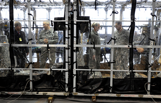 Members of the local area media and Scott AFB medical personnel tour the Transport Isolation System Jan. 23, during a rollout ceremony for the system on Scott AFB, Illinois. DTRA worked extremely fast to bring the TIS from concept to production model in just a few months. Photo by Bob Fehringer, USTRANSCOM/PA